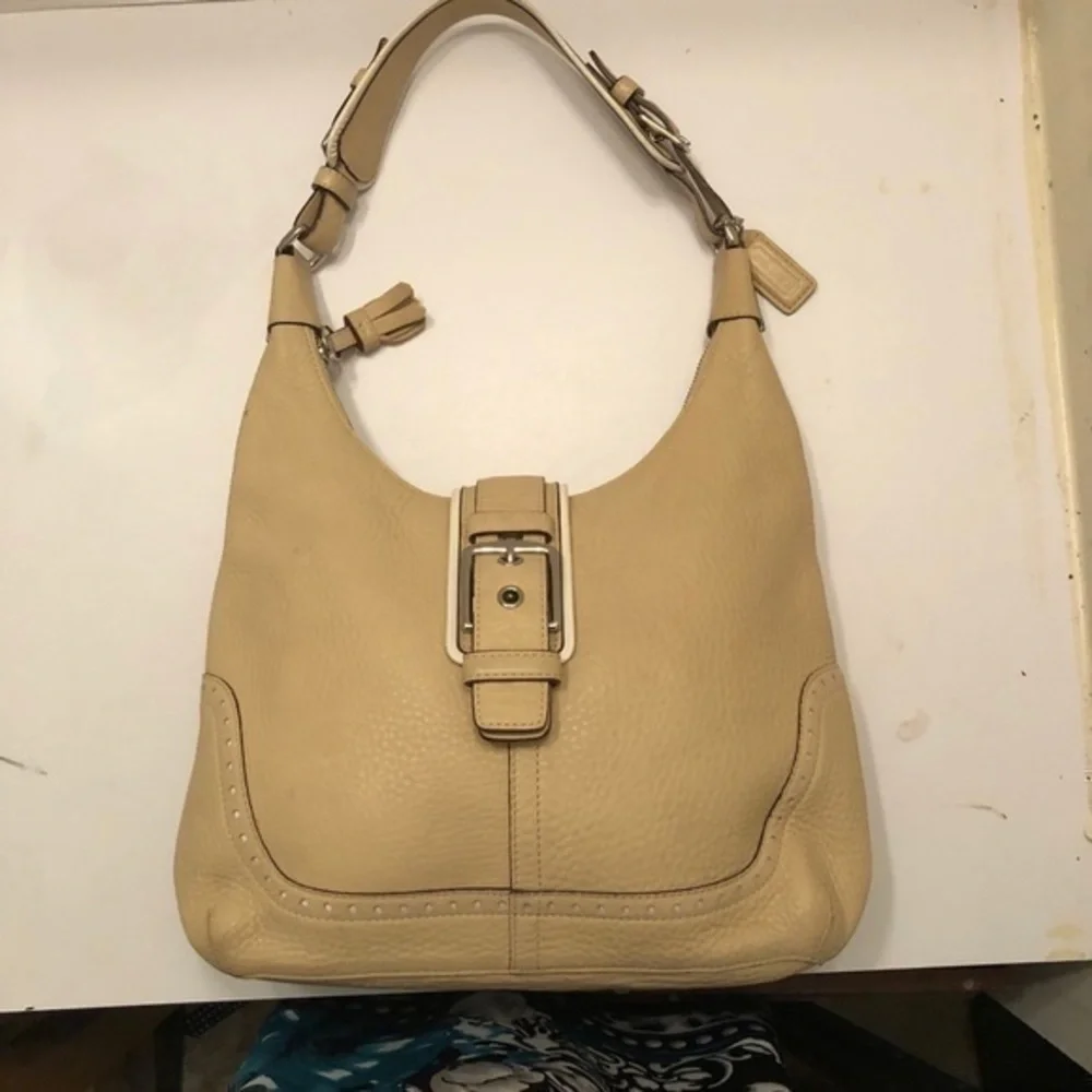 Coach cream pebbled leather perforated hobo bag